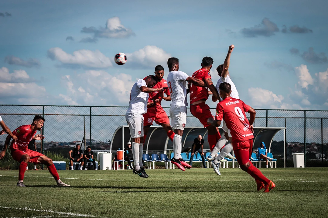 Athletes contesting an aerial ball